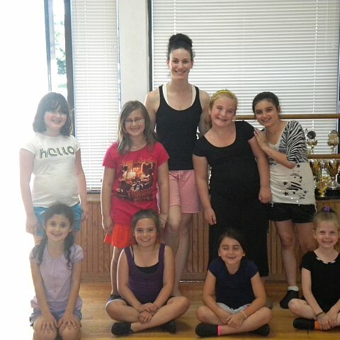 A group of young girls at a dance studio with their dance teacher Lauren O’ Brien